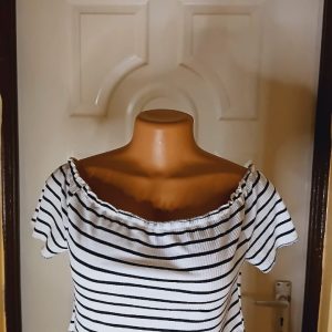 Short sleeved white off shoulder top with black stripes